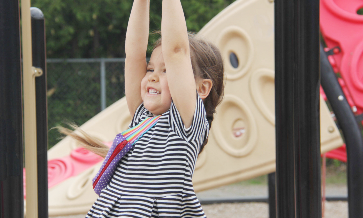 Epicute's "Chief Tester" Esmee loves to wear The Daydreamer Classic Epicute Pouch everyday - including while showing the monkey bars whose boss!