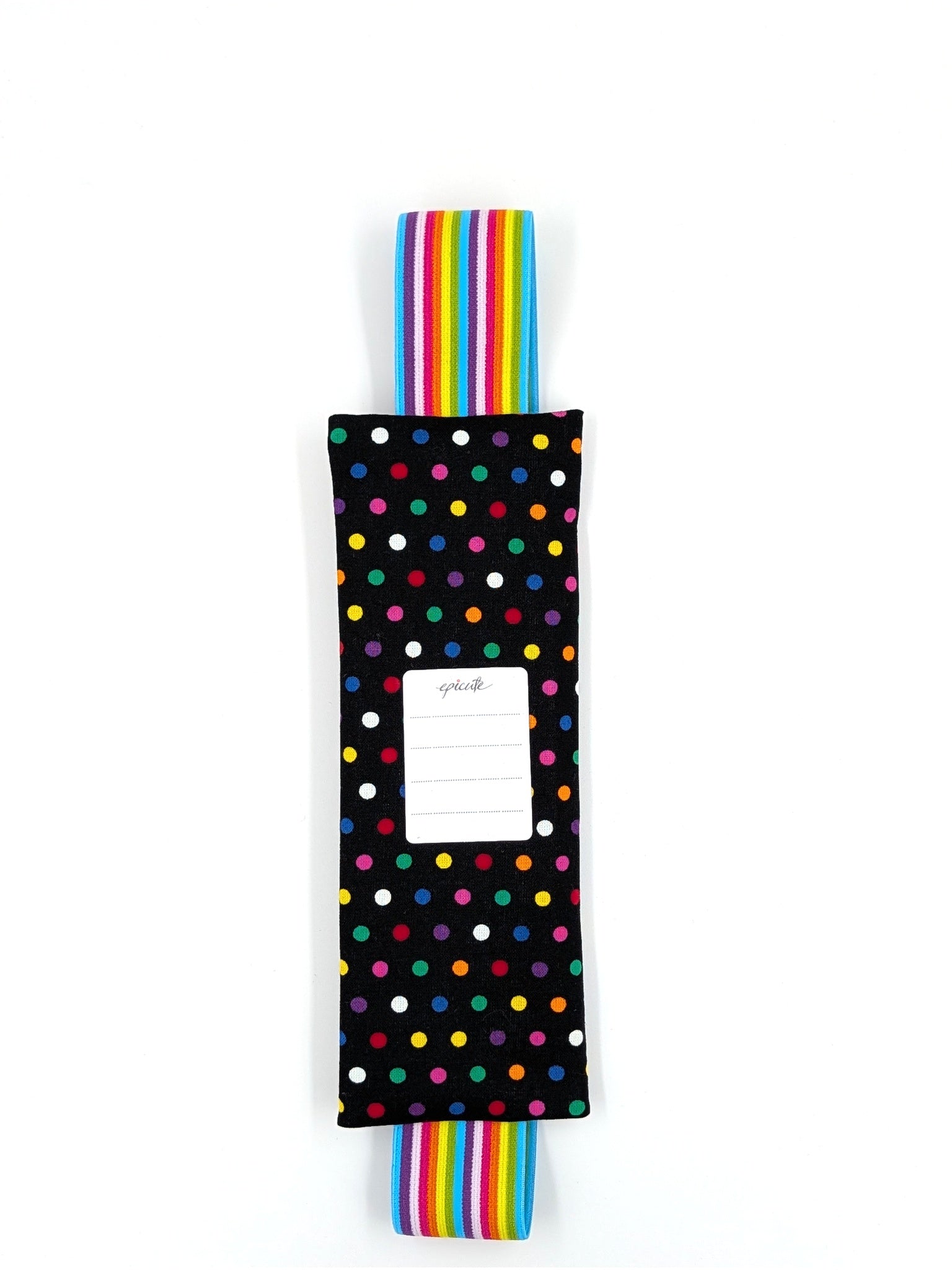 The Daydreamer EpiPen pouch in a black confetti dot print with the rainbow elastic strap, back view, showing the care label