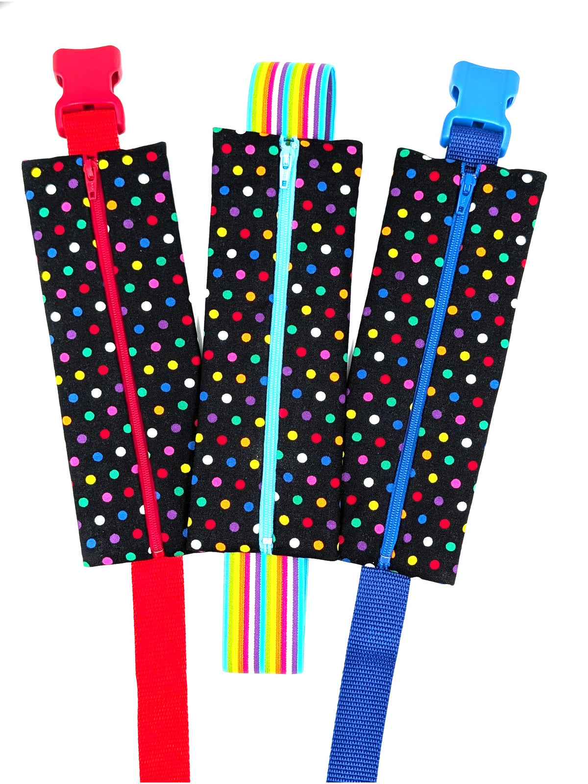 The Daydreamer EpiPen pouch in a black confetti dot print shown with all three strap options, closed