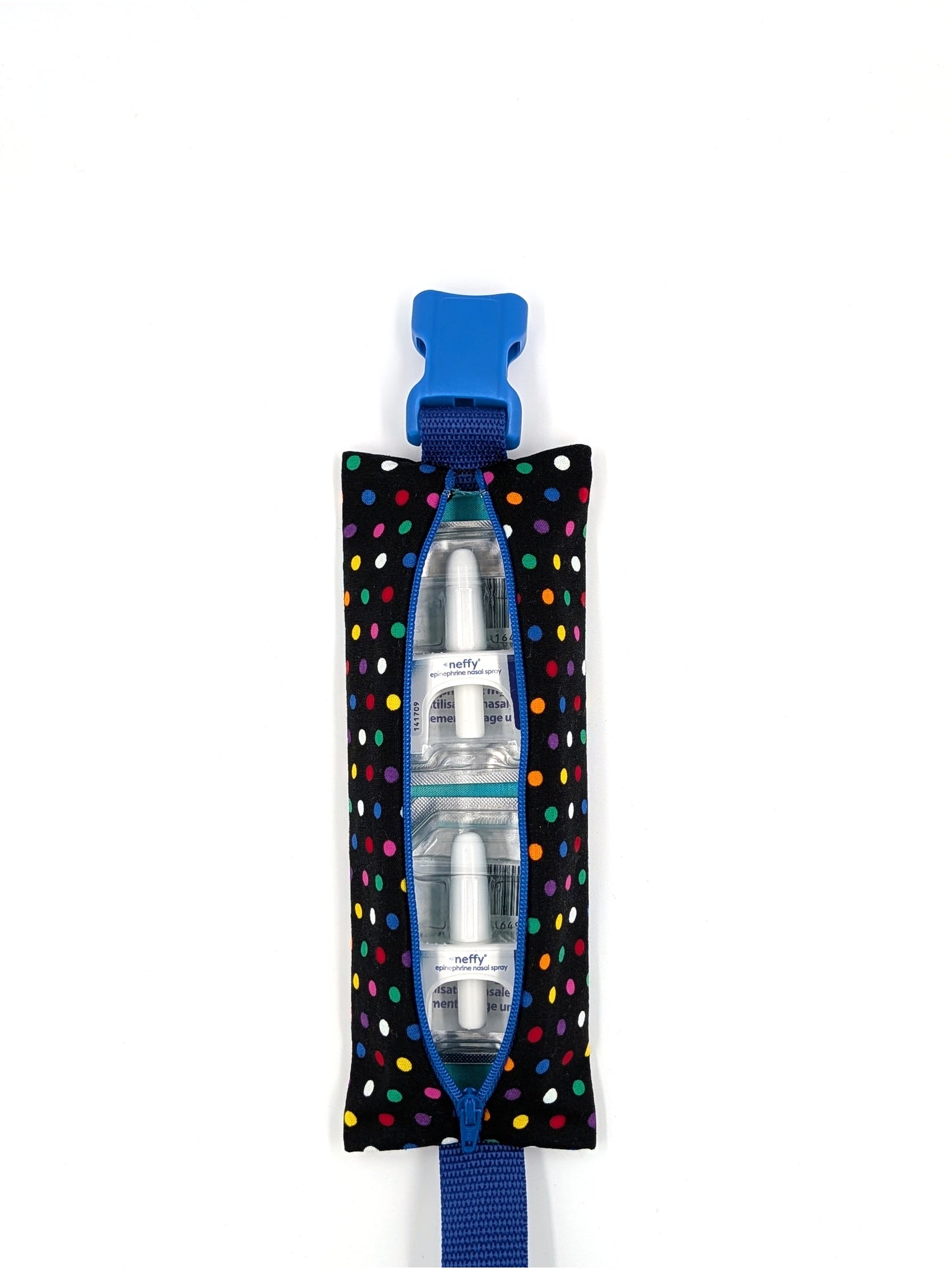 The Daydreamer EpiPen pouch in a black confetti dot print with the blue adjustable belt, open with two neffy nasal spray doses inside
