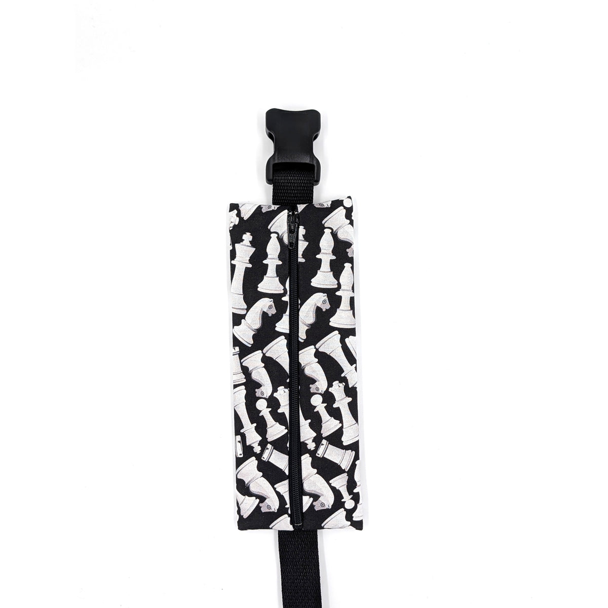 The Grand Master EpiPen pouch in a black and white chess print, closed, shown with its adjustable belt