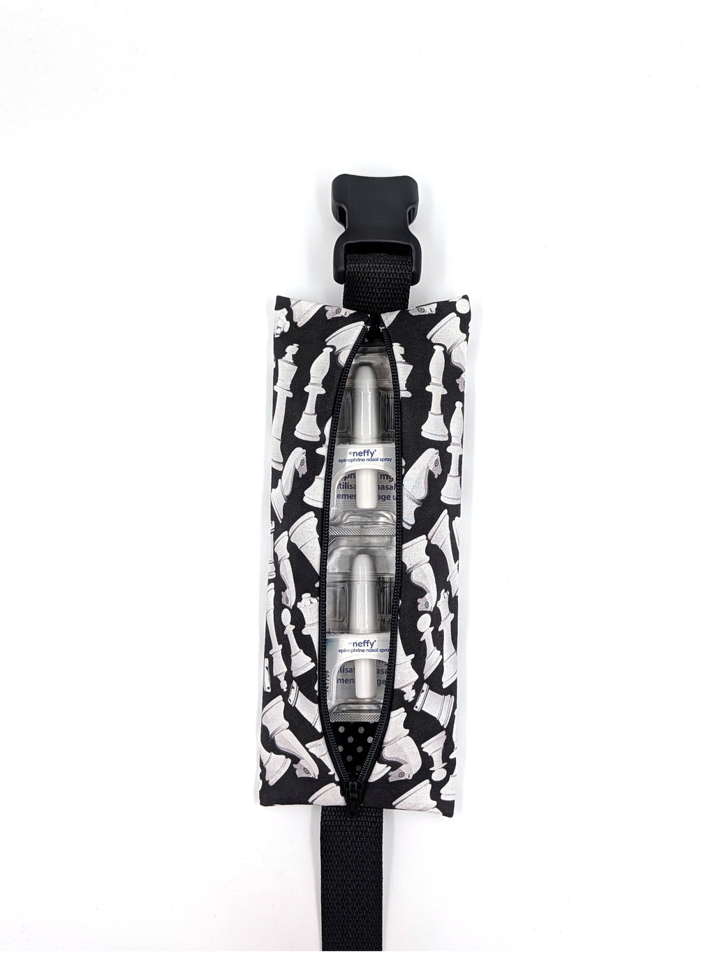 The Grand Master EpiPen pouch in a black and white chess print, shown in use