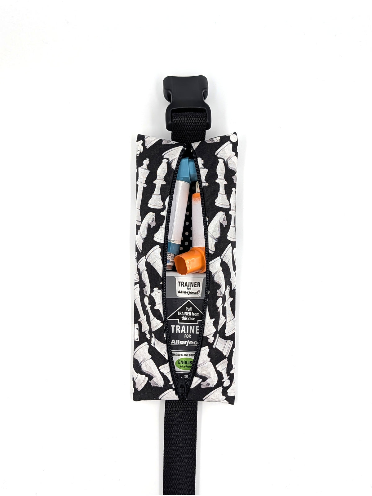 The Grand Master EpiPen pouch in a black and white chess print, open with inhalers inside
