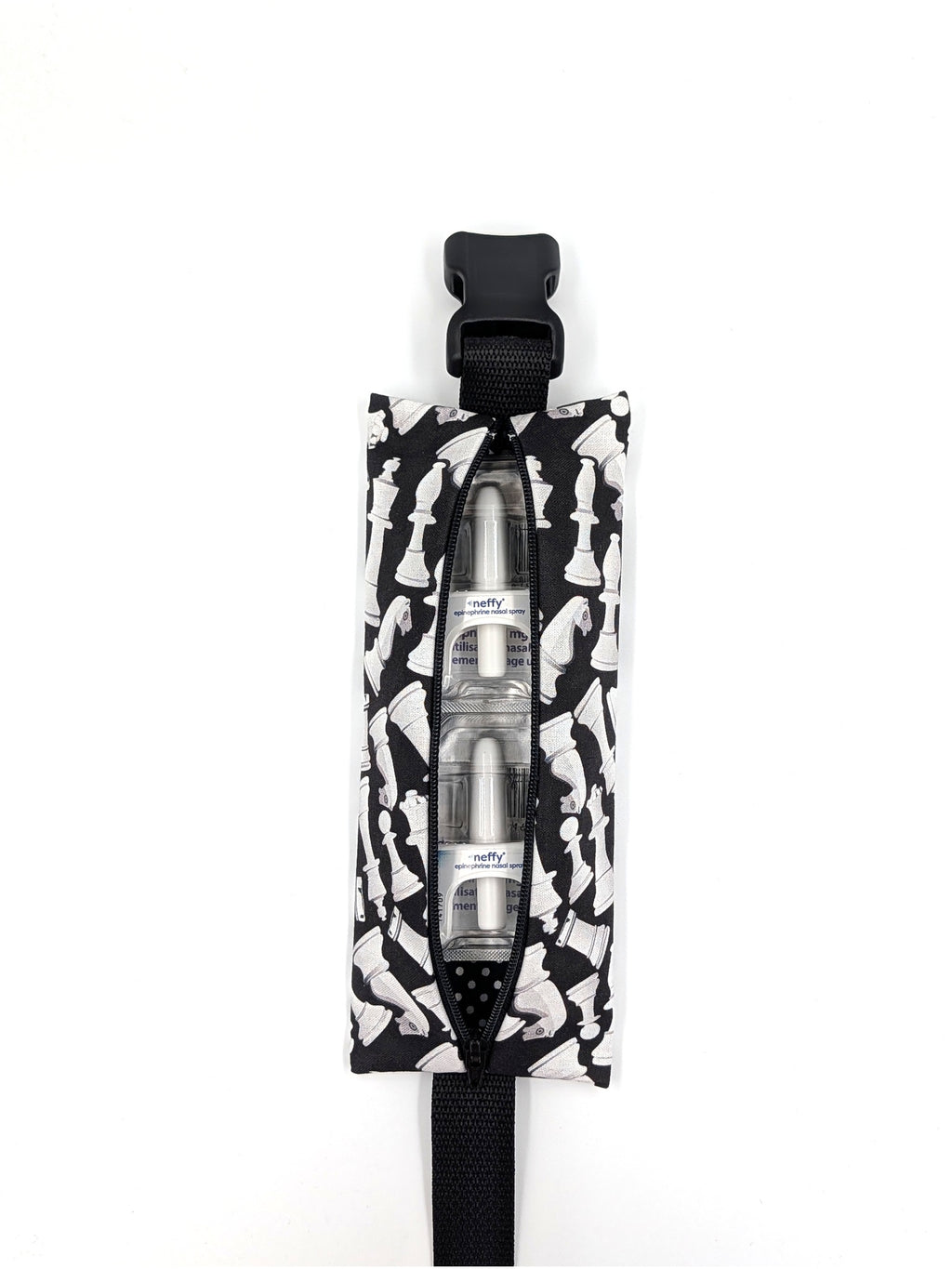 The Grand Master EpiPen pouch in a black and white chess print, open with two neffy nasal spray doses inside