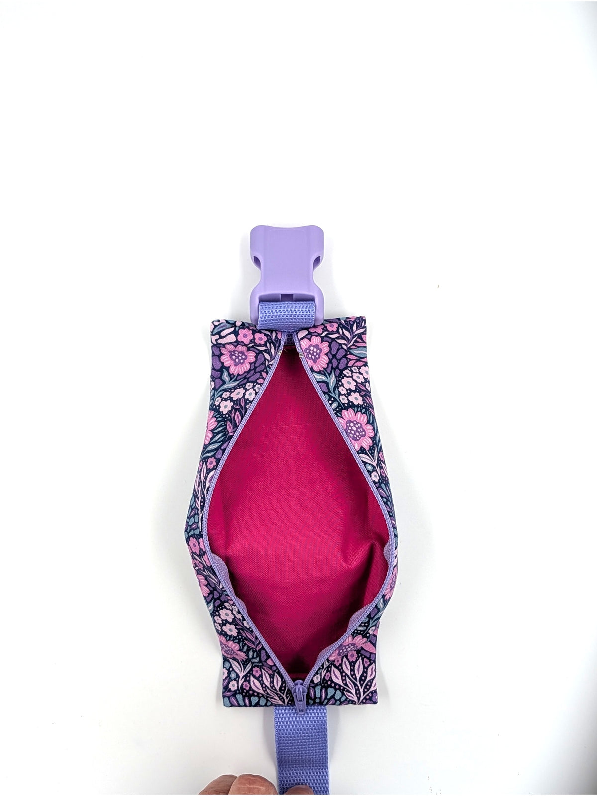 The Poet EpiPen pouch in a navy floral print, unzipped and empty, showing the interior liner