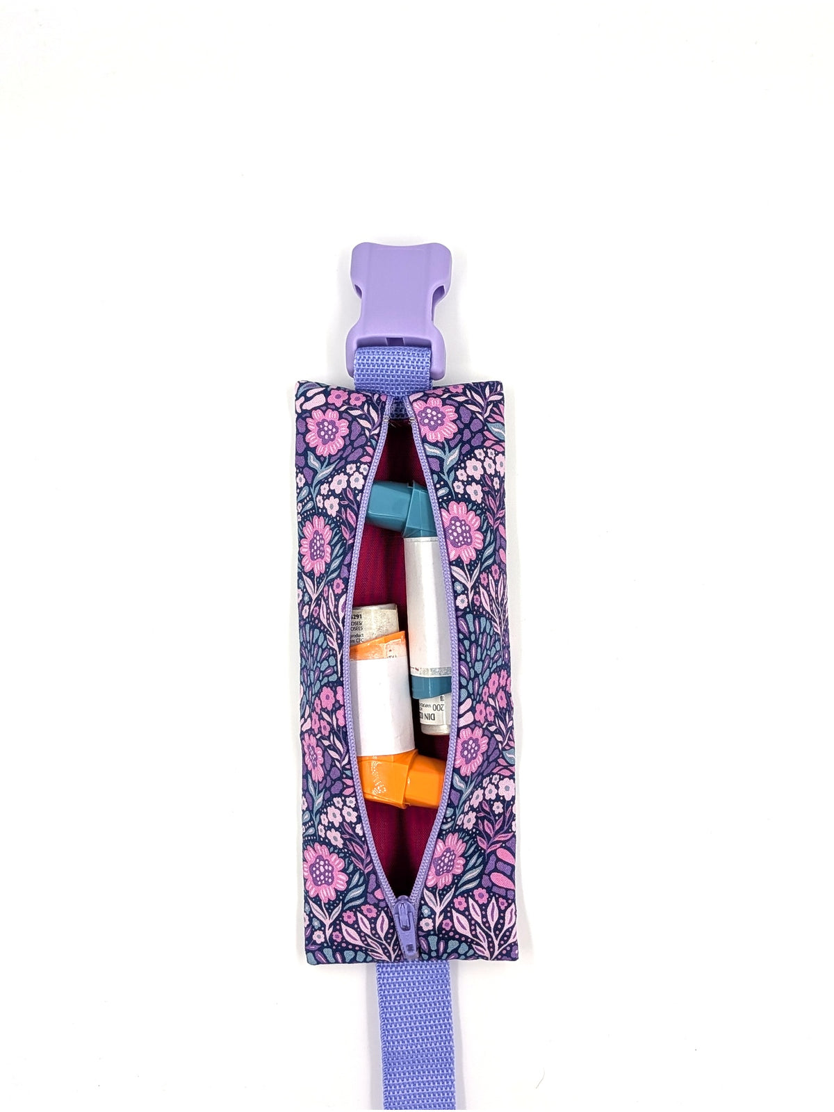 The Poet EpiPen pouch in a navy floral print, open with inhalers inside