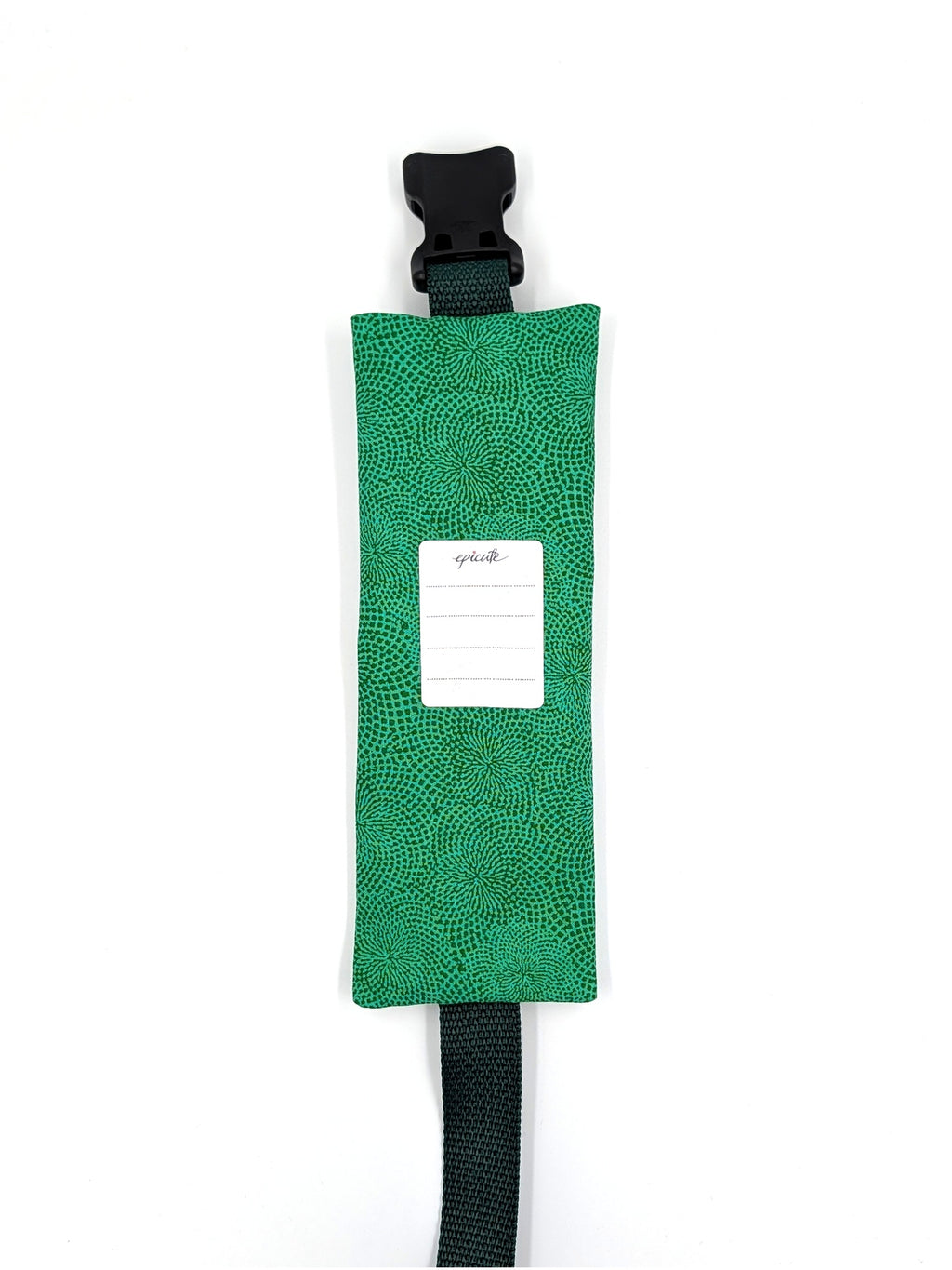The Scout EpiPen pouch in an emerald green starburst print, back view, showing the care label