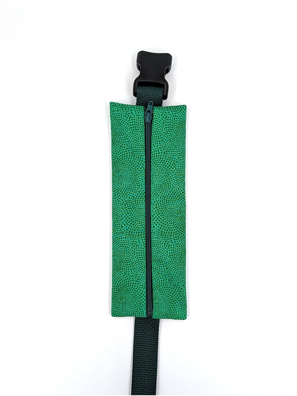 The Scout EpiPen pouch in an emerald green starburst print, closed, front view