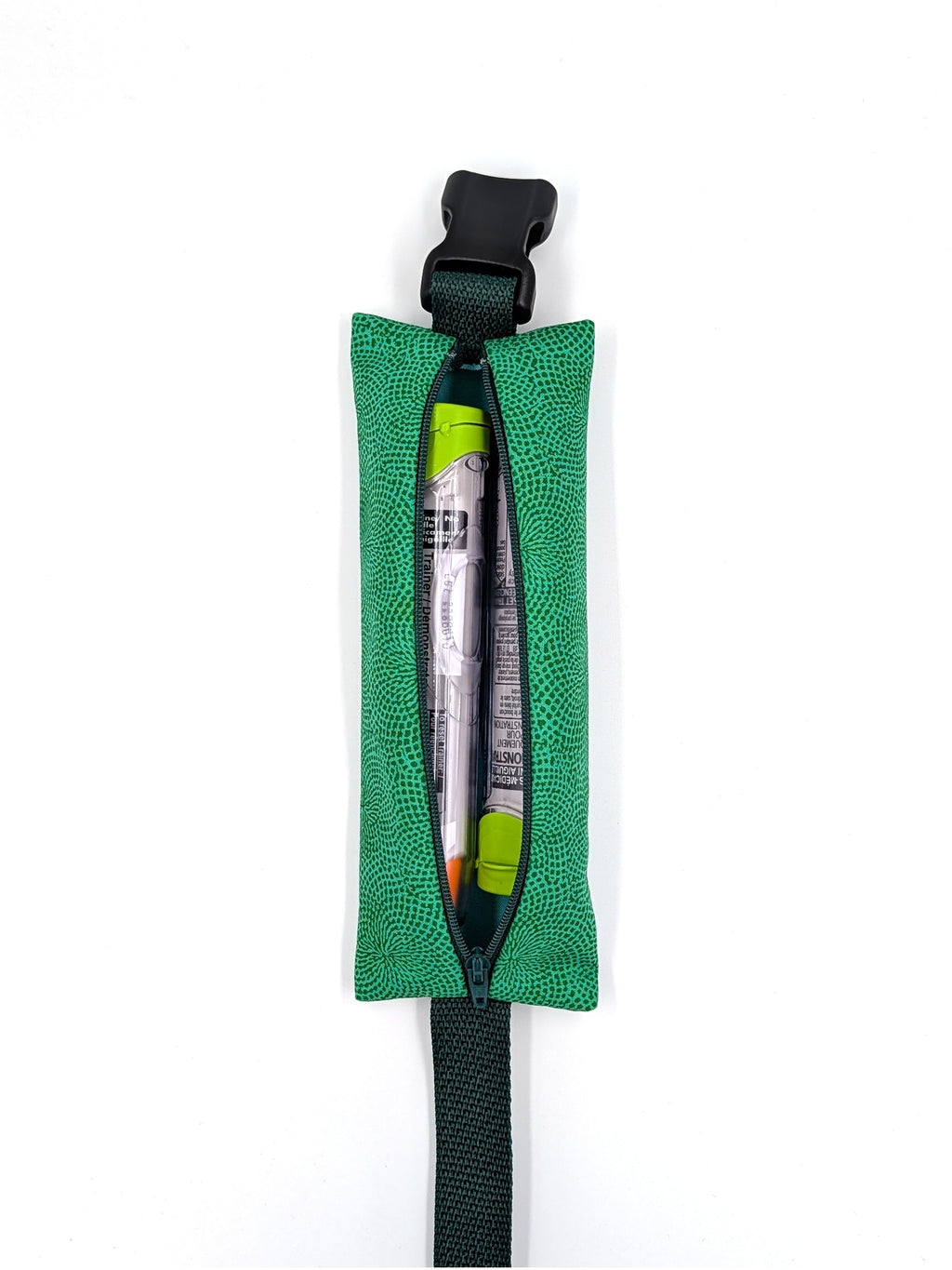 The Scout EpiPen pouch in an emerald green starburst print, open with two EpiPen auto-injectors inside