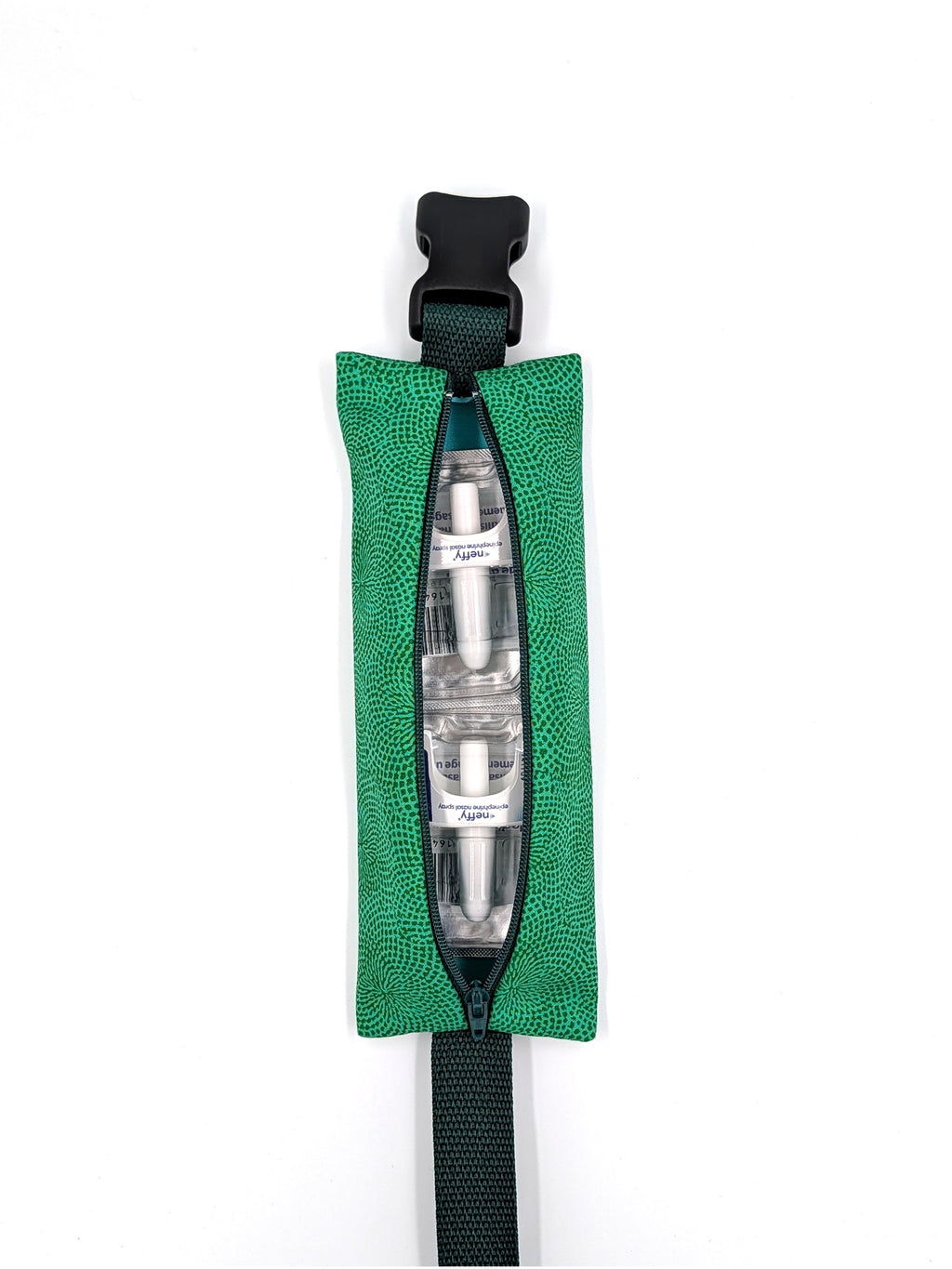 The Scout EpiPen pouch in an emerald green starburst print, open with two neffy nasal spray doses inside